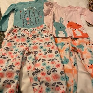 Two pairs of new Carters pjs.